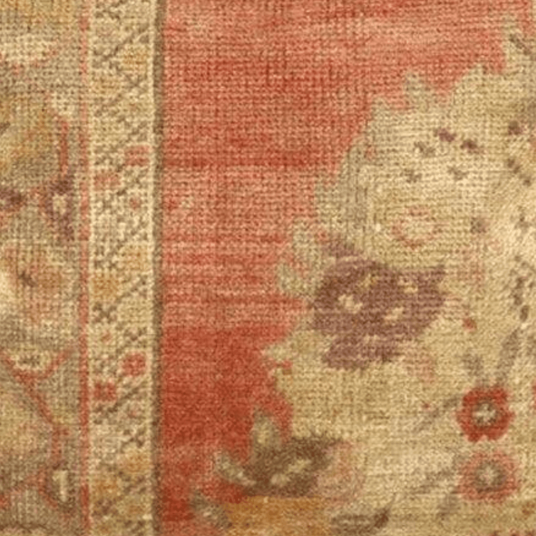 Decorative pillow with floral pattern and red background on a white background