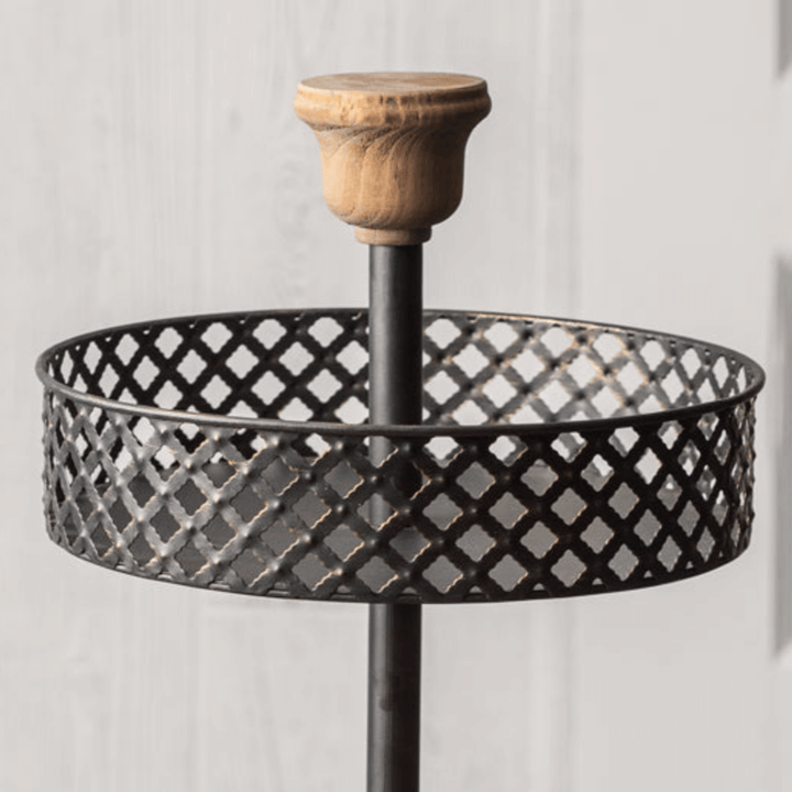 Vintage two-tier fruit basket stand with metal lattice design and rustic wooden handle. Perfect for kitchen decor.
