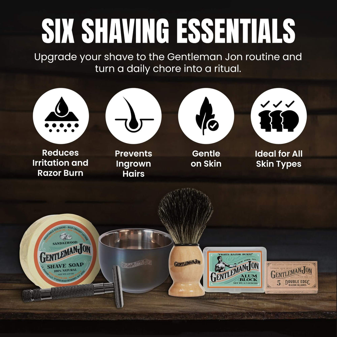 Gentleman Jon shaving essentials set on a wooden surface with a dark wood background.