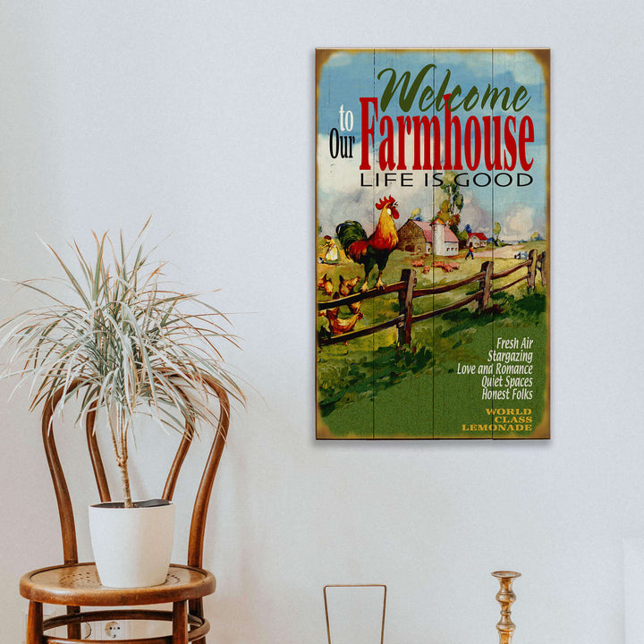 Vintage Farmhouse Welcome to Our Home Wall Sign hanging on a wall with rustic decor, showcasing country life and hospitality.