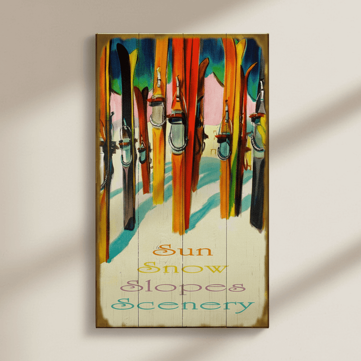 Decorative wall art with skis and snow-themed text on a wooden panel.