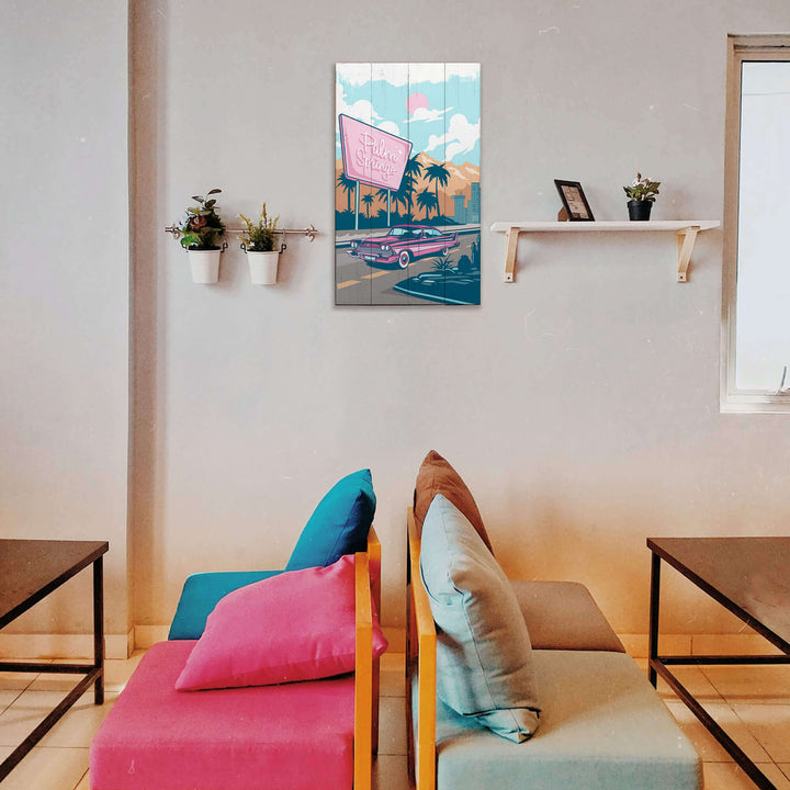 Modern living room with colorful cushions on a sofa and a decorative wall art piece.