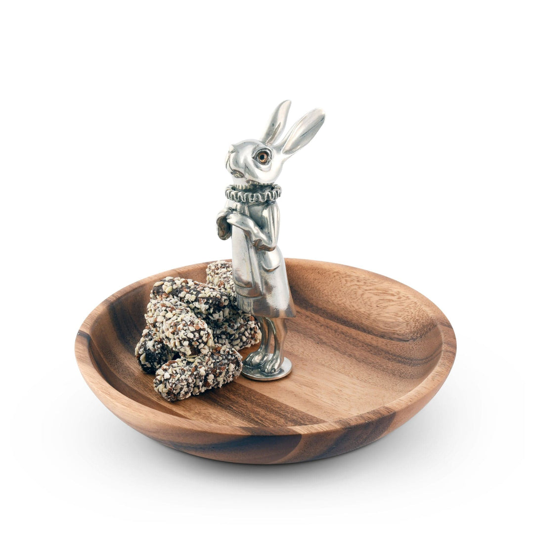 Wooden bowl with a silver rabbit on a white background