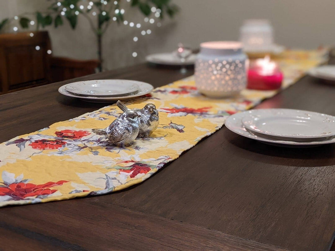 Yellow Floral Vintage Hummingbirds Garden Table Runner (925) on dining table with floral patterns.