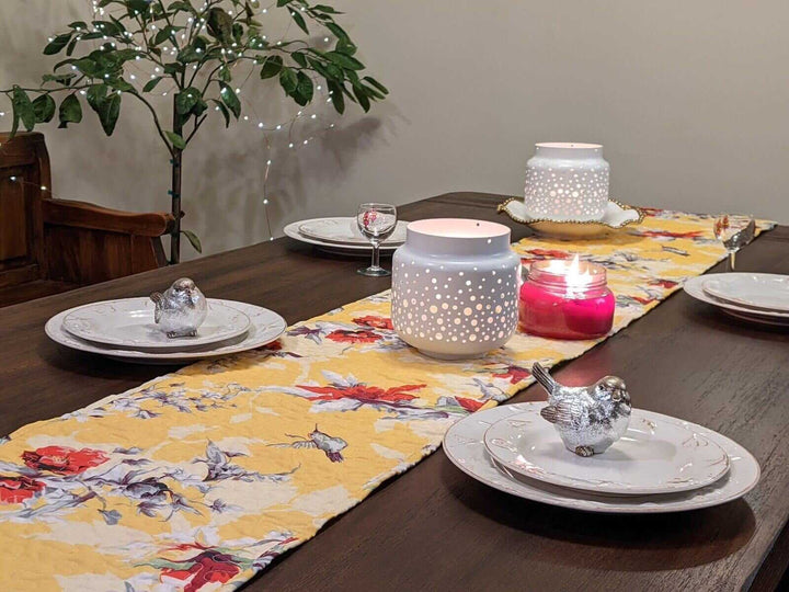 Yellow Floral Vintage Hummingbirds Garden Table Runner (925) on a decorated dining table with candles.
