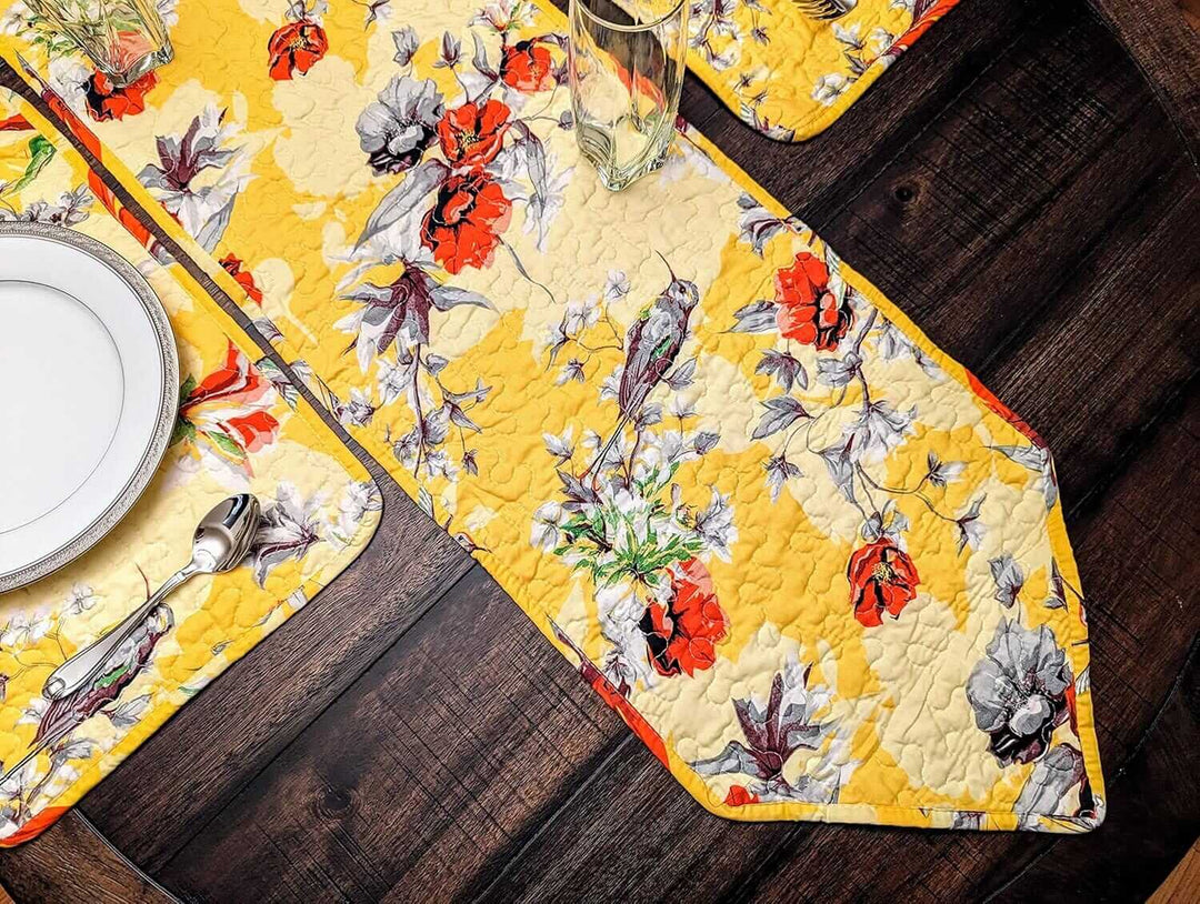 Yellow Floral Vintage Hummingbirds Garden Table Runner (925) displayed on dark wood with plates and cutlery