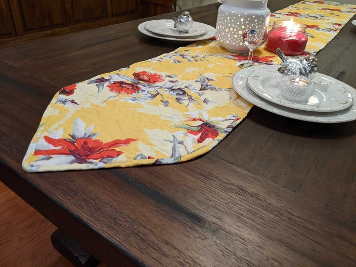 Yellow Floral Vintage Hummingbirds Garden Table Runner (925) with floral and hummingbird pattern on table.