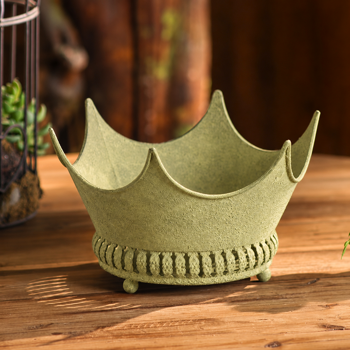 Empty crown planter showing the curved points and decorative base