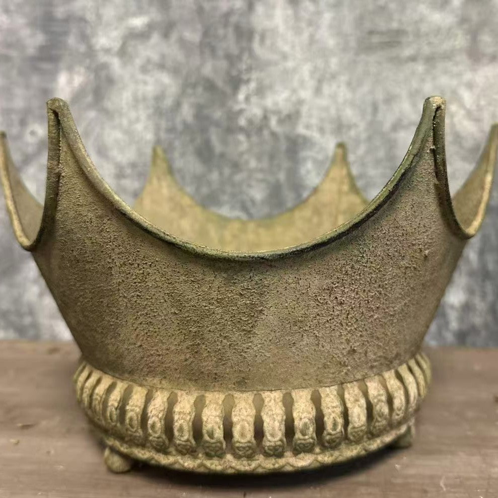 Front close-up of the aged olive-gold finish and crown silhouette