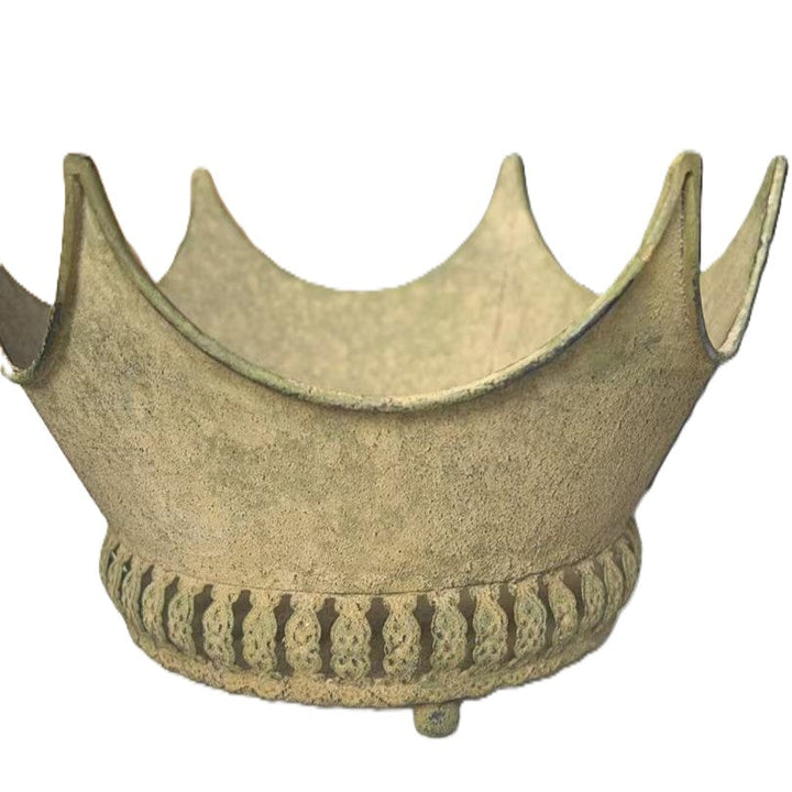 Angled isolated view showing the openwork band and small rounded feet
