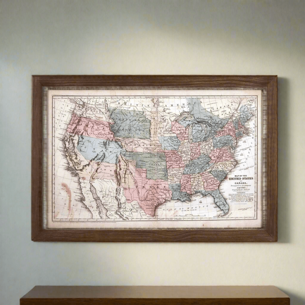 Antique 1850s United States wall map in a dark wooden frame, featuring pastel colors and intricate 19th-century cartography.