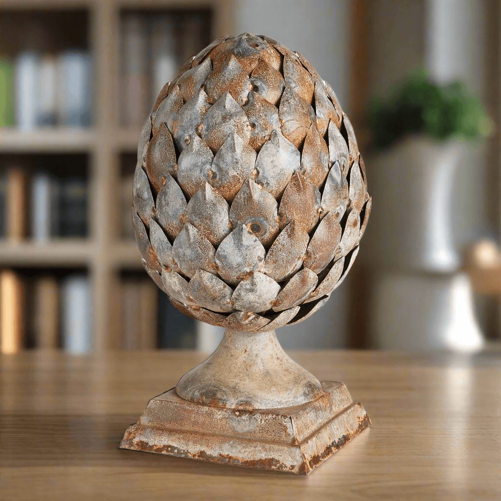 Antique artichoke ornament on pedestal base, showcasing rustic charm and Old World elegance for home decor.