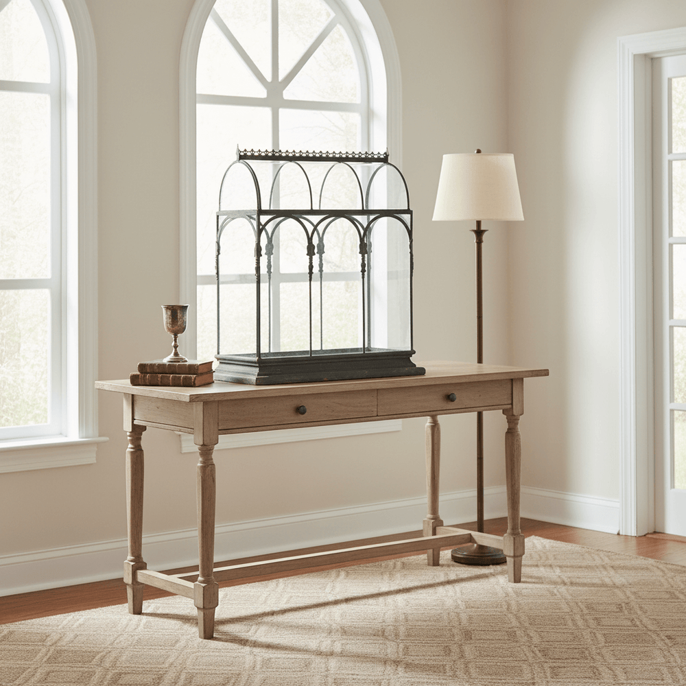 Antique Black Iron Conservatory Tabletop Terrarium with Victorian Arch Detail on wooden table in bright room