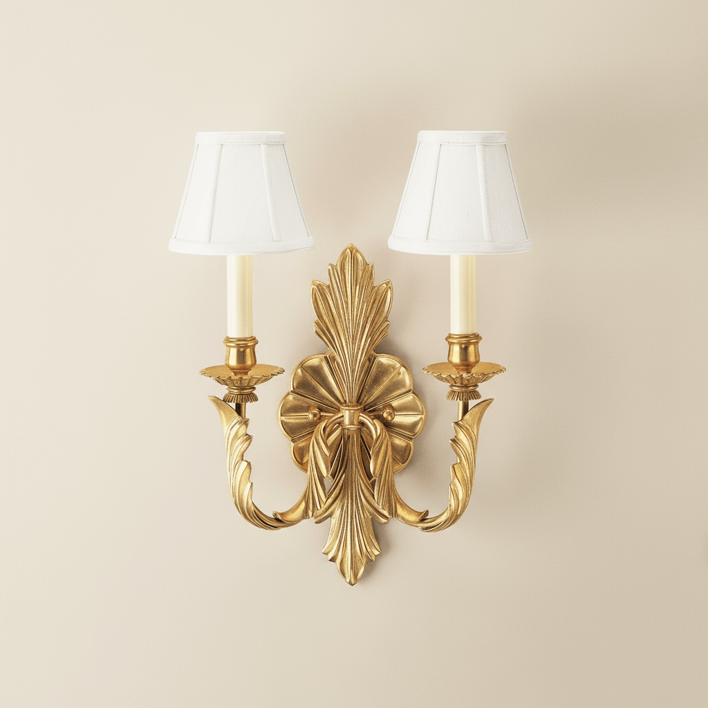Antique Brass Double Arm Sconce with Pleated Shades, featuring neoclassical design with sculpted leaves and elegant pleated shades.