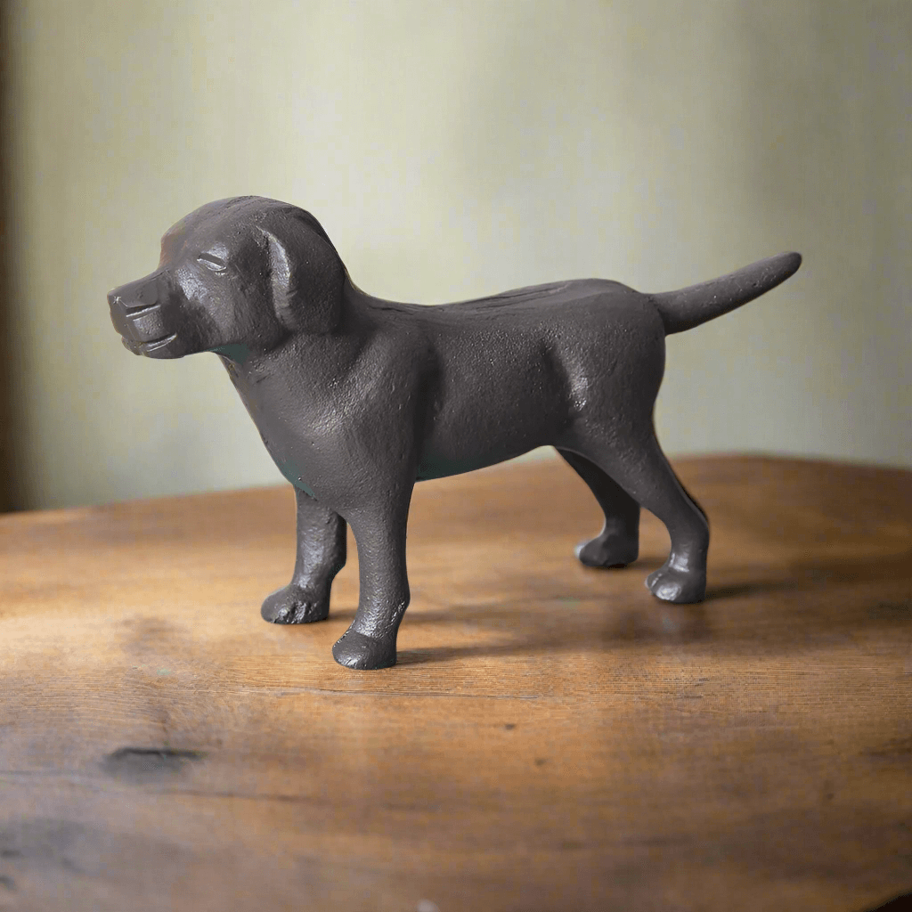 Antique cast iron dog figurine showcasing a loyal and charming design, perfect for vintage decor.