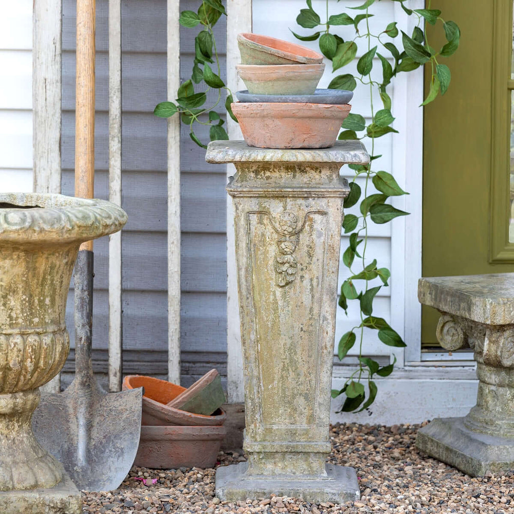 Antique European square garden pedestal with ornate relief details, perfect for displaying plants or decorative items in an outdoor setting.