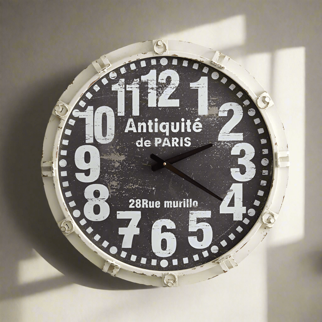 Antique French country wall clock with weathered white frame and vintage numbers, inspired by Parisian elegance.