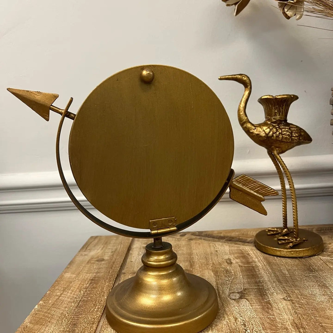 Side view of the arrow-shaped tabletop clock and supporting base