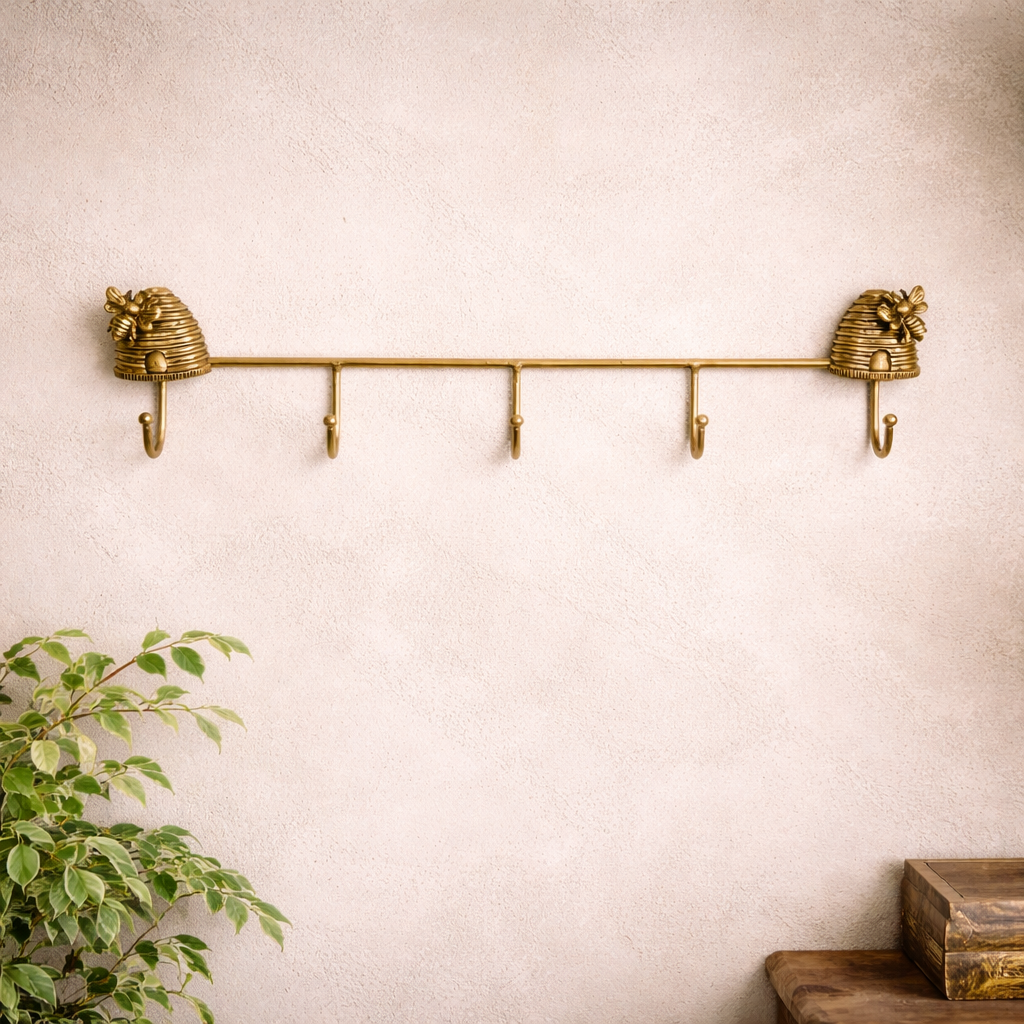 Five-hook beehive wall rack mounted above a wood bench