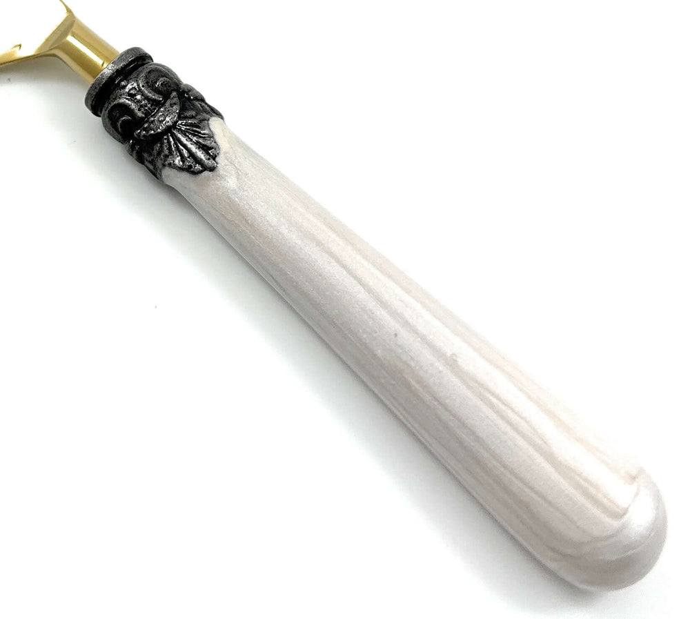 Close-up of Antique Gold Flatware with White Handles (Set of 20), showing intricate antique design, gold finish, and white handle detail.
