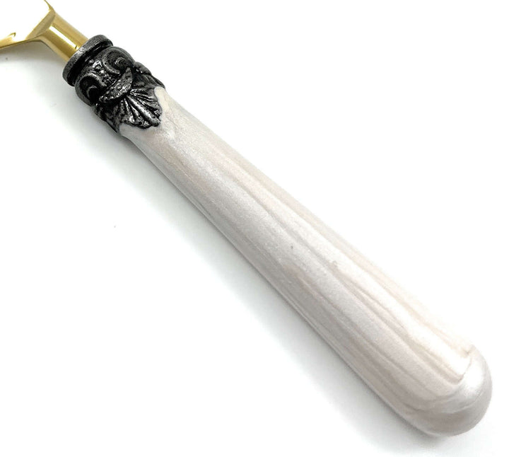Close-up of Antique Gold Flatware with White Handles (Set of 20), showing intricate antique design, gold finish, and white handle detail.