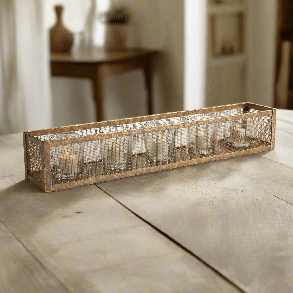 Antique gold mesh candle holder centerpiece tray with glass votives on rustic table