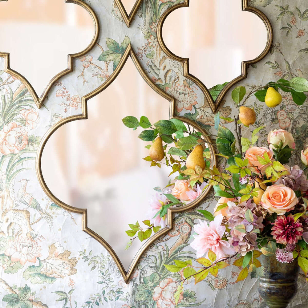 Antique gold Moroccan ogee mirror with floral decor, featuring an elegant ogee silhouette inspired by Moroccan architecture.