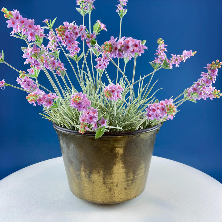 Antique Hand-Hammered Brass Bucket with Wrought Iron Handle: Rustic Farmhouse Decor filled with pink flowers.