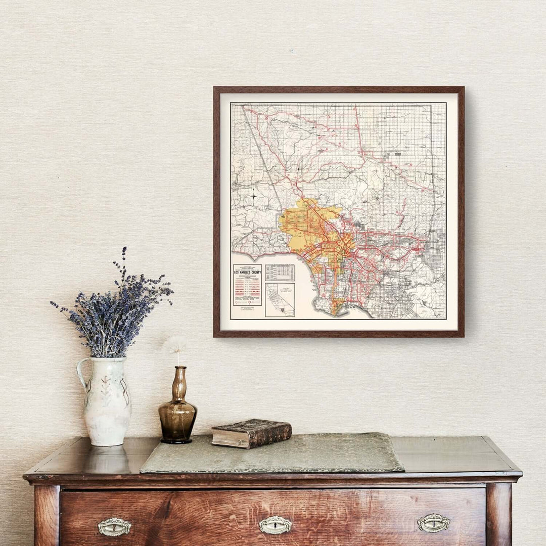 Antique Map of Los Angeles County, California from 1935 displayed on a wall above a vintage cabinet.