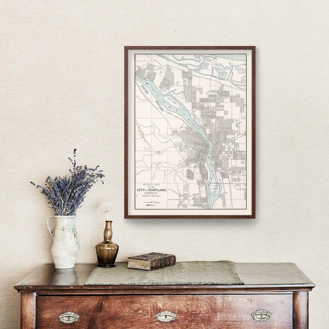 Antique Map of Portland, Oregon from 1901 framed on wall above vintage wooden dresser with decor
