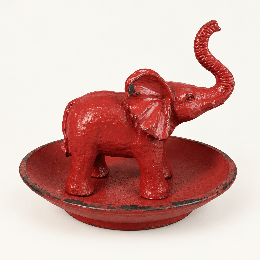 Antique Red Pewter Elephant Ring Dish on an ivory studio background