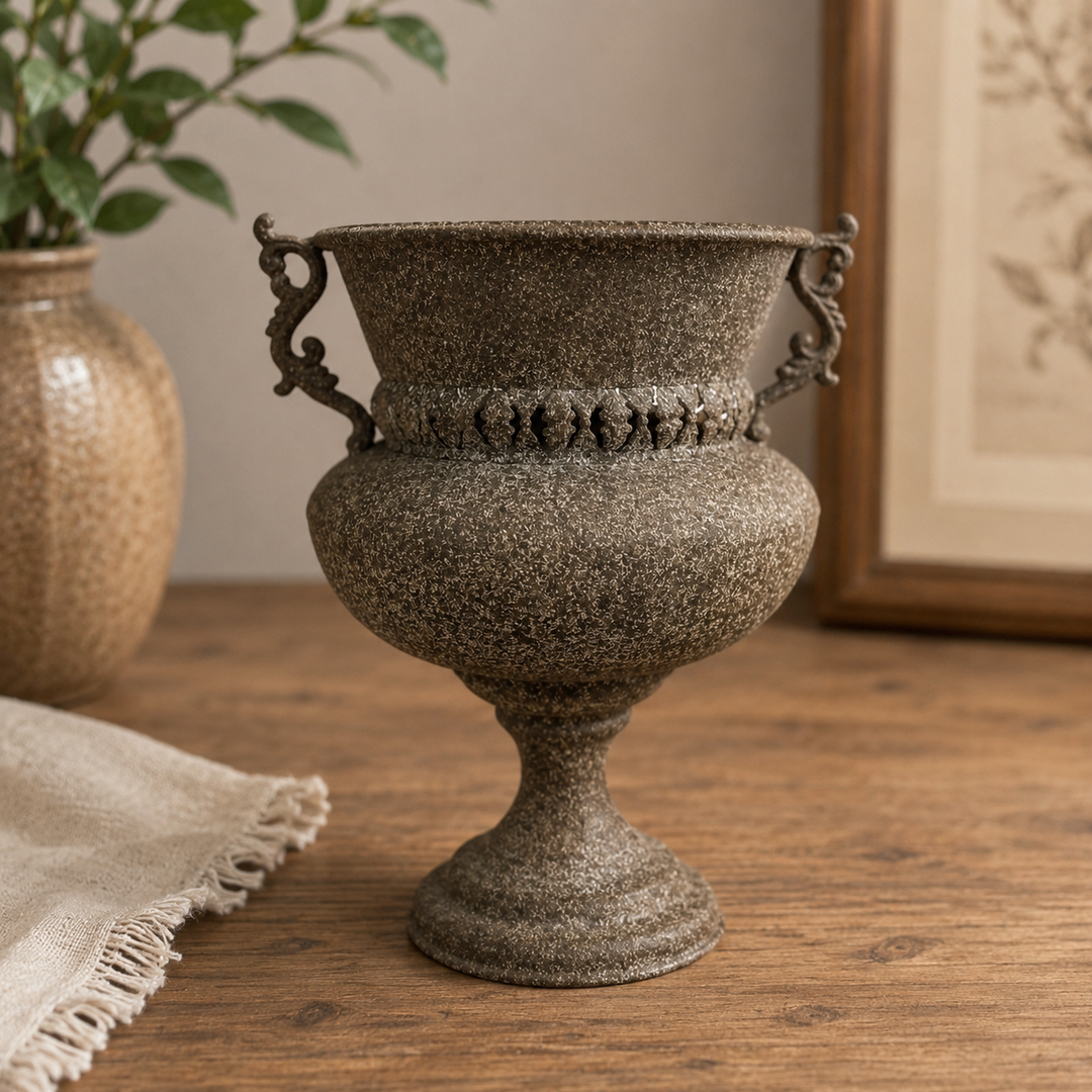 Close view of the flared rim, pierced neck band, and scroll handles