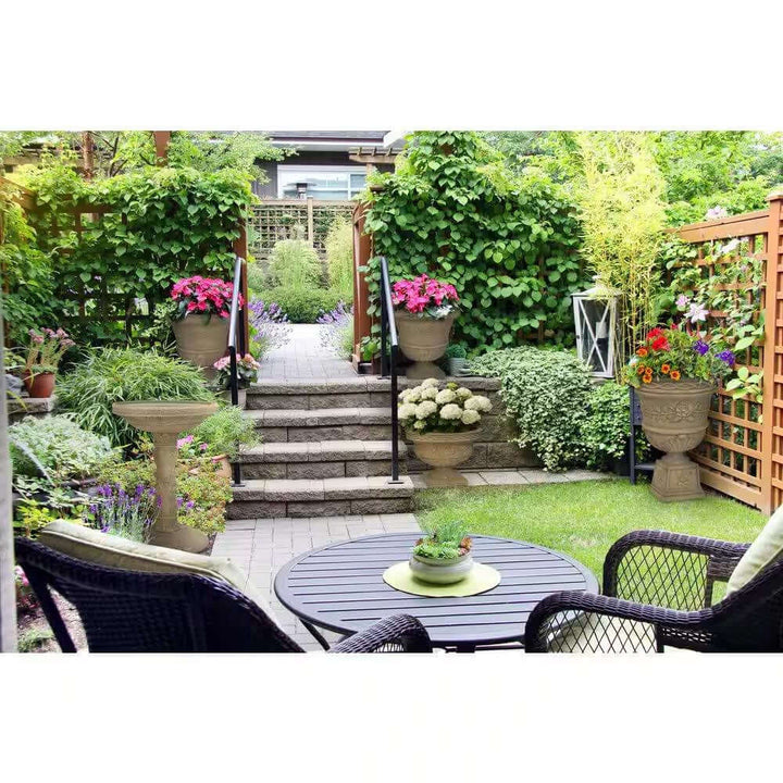 Lush garden setting with an Antique-Style Garden Bird Bath in Aged Granite as a focal point.