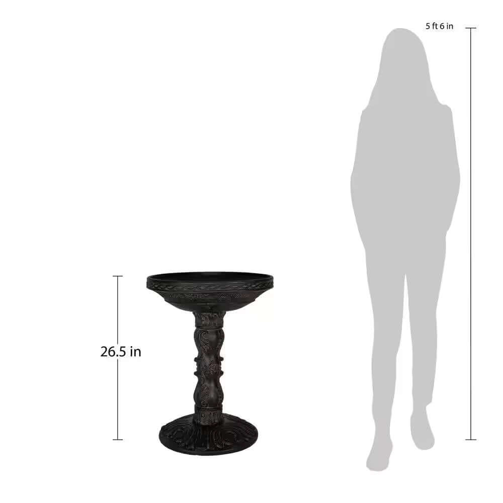 Antique-Style Garden Bird Bath in dark finish, 26.5 inches tall with human silhouette for size reference. Elegant garden decor item.