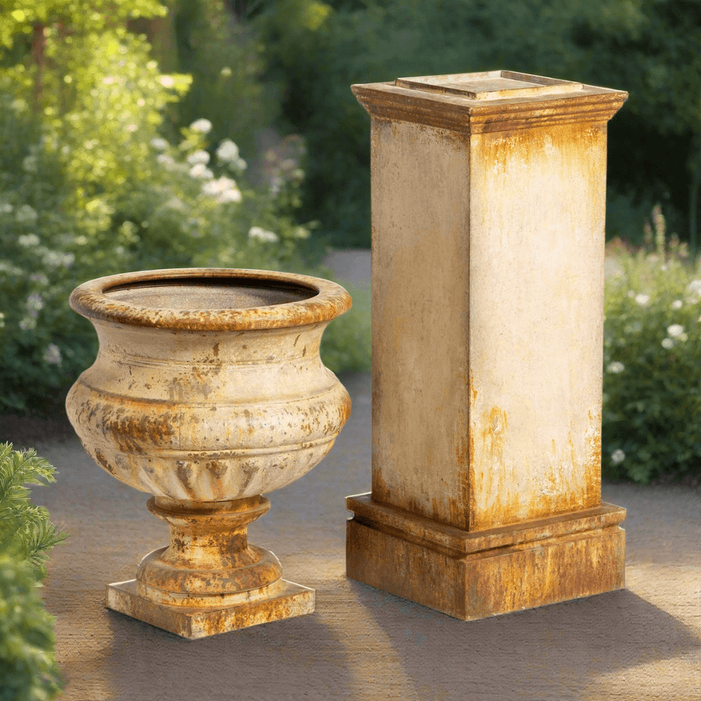Antique-style iron garden urn on tall pedestal with aged rusted patina, ideal for vintage outdoor decor.