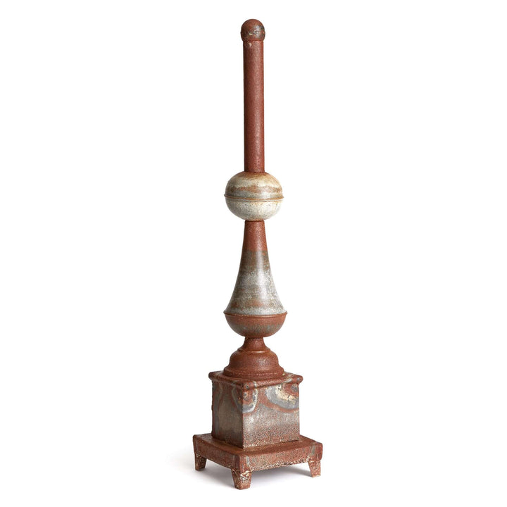 Antique-style rusted metal finial decor featuring a weathered patina and classical European design elements.