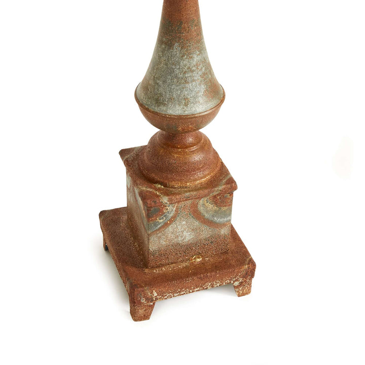 Antique-style rusted metal finial decor with weathered patina, perfect for adding vintage charm to any space.