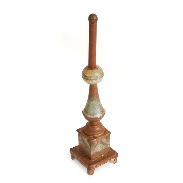 Antique-style rusted metal finial decor with a weathered patina, perfect for vintage home accents.