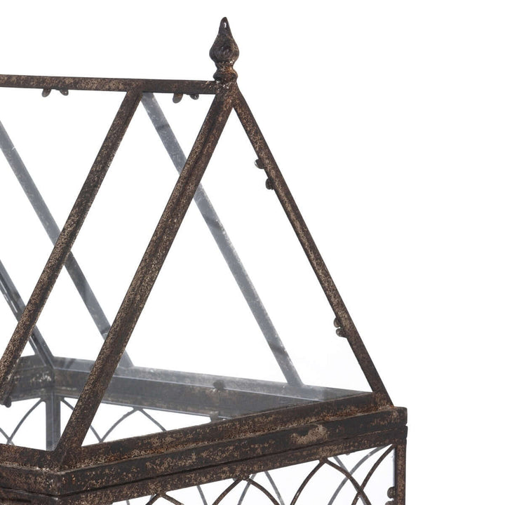 Antique Black Iron Standing Garden Terrarium with Gothic Arch Detail features an intricate iron frame and triangular glass panels.