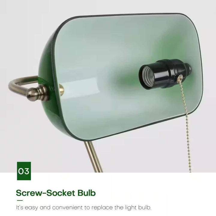 Close-up of the Antique Brass Bankers Lamp with Green Glass Shade showcasing the screw-socket bulb design.