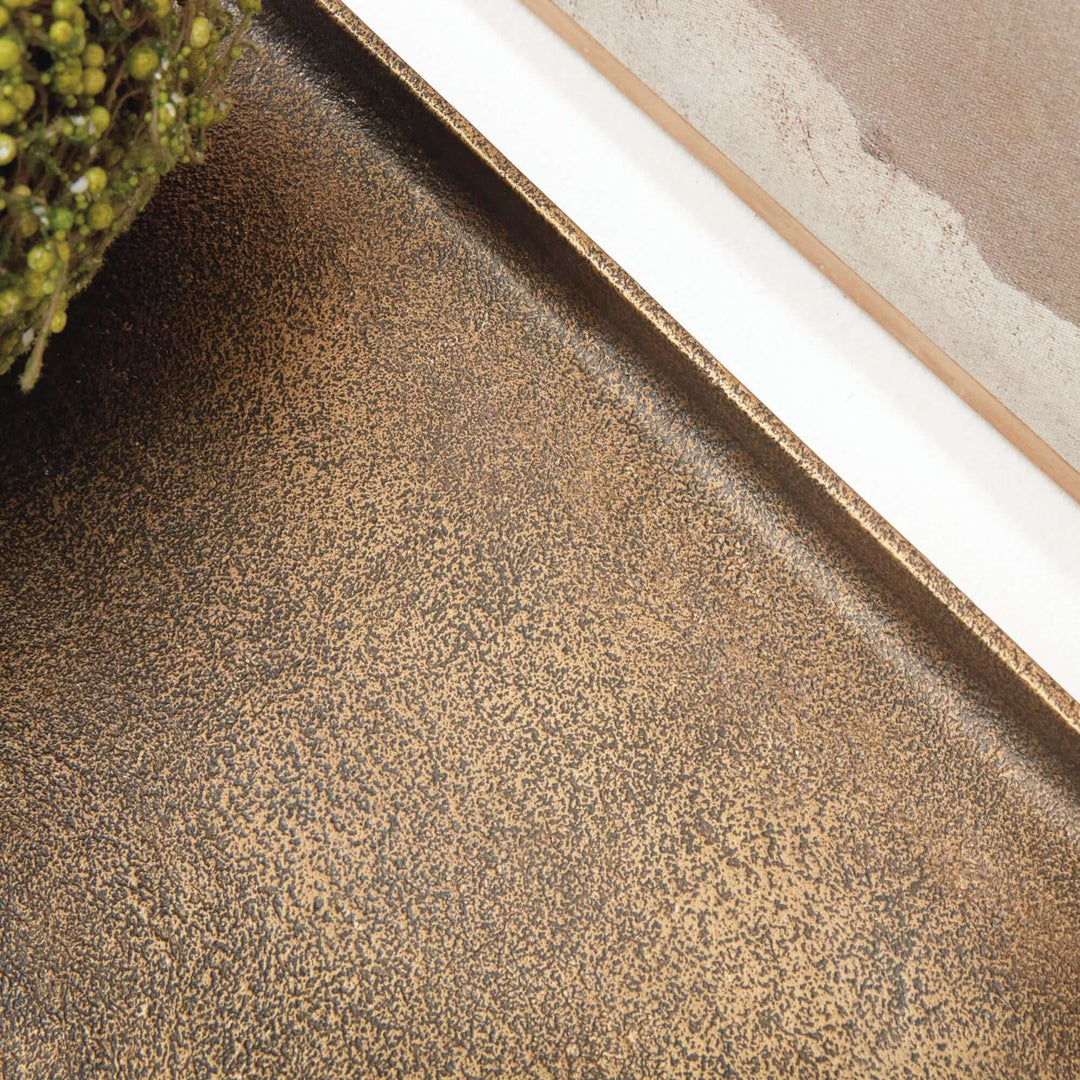 Close-up of antique brass raised display tray with textured finish, highlighting its craftsmanship and vintage charm.