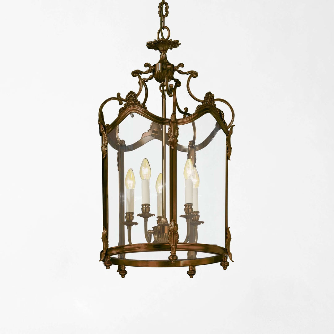 Antique Bronze Italian Lantern Chandelier with ornate design and glowing candles, crafted by Italian artisans for vintage elegance.