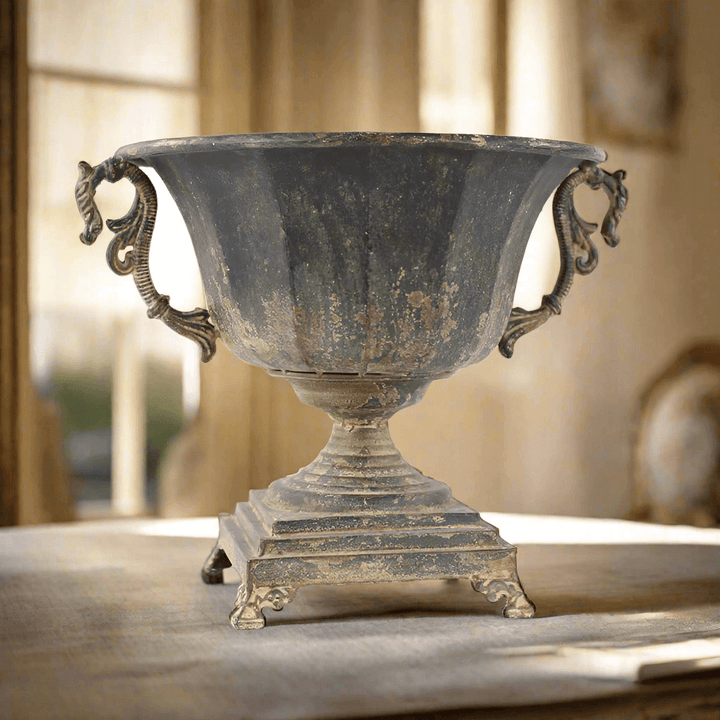 Antique Decorative Urn in Distressed Metal with historical charm and rustic elegance, perfect for sophisticated interior design.