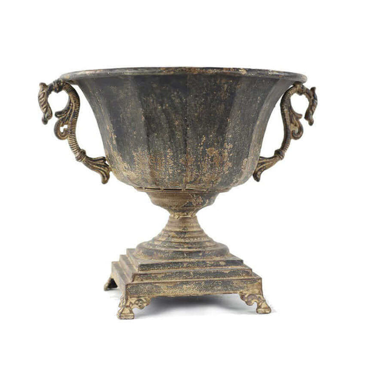 Antique Decorative Urn in Distressed Metal with historical charm and sophisticated design, featuring ornate handles and rustic finish.