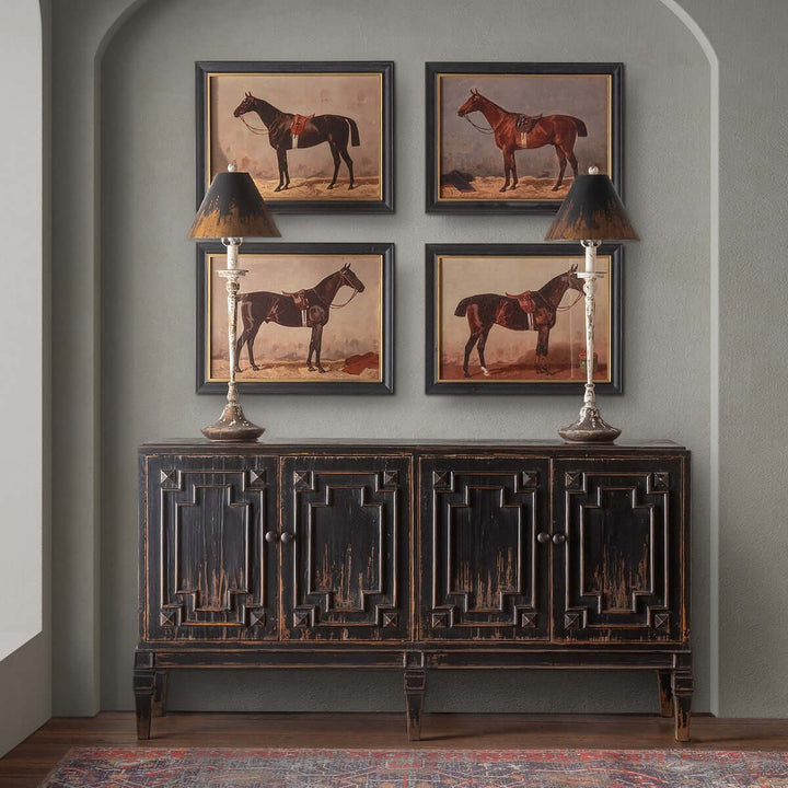 Antique farmhouse buffet with distressed lamps and horse paintings on wall, creating an elegant rustic decor ambiance.