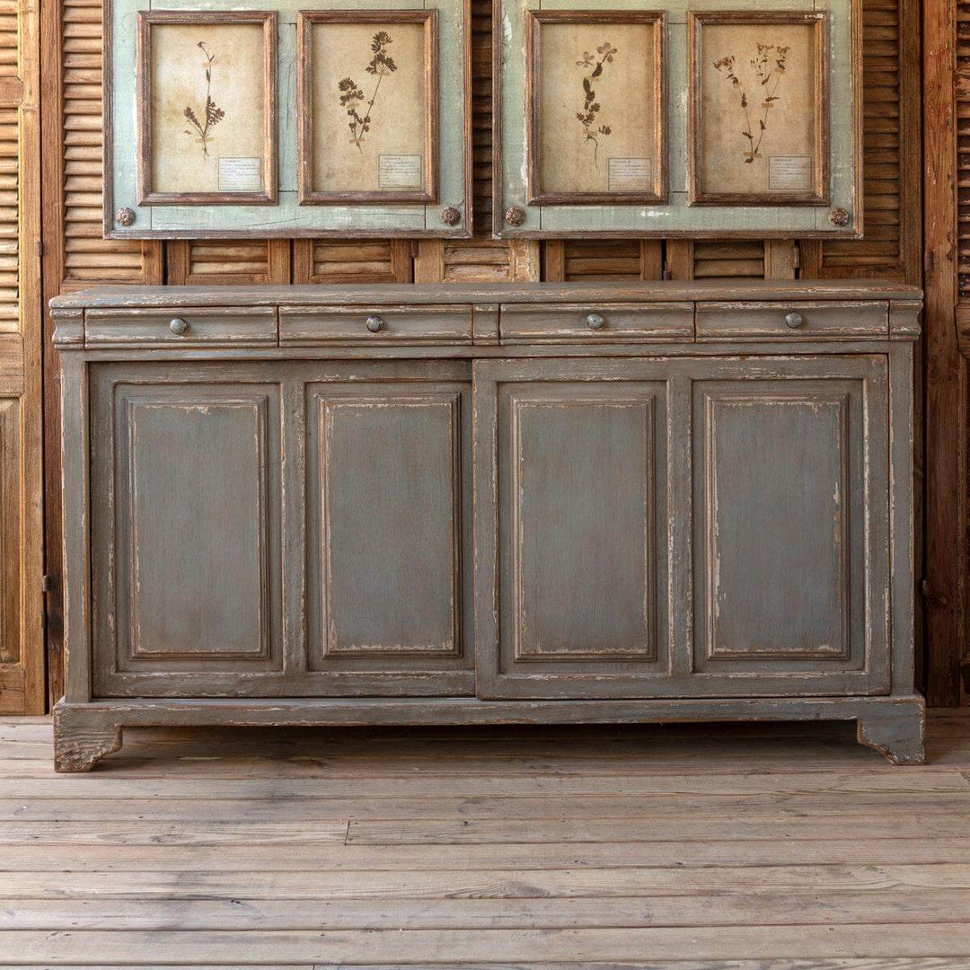 Antique French Country Buffet Cabinet with distressed gray finish and charming farmhouse style in rustic setting