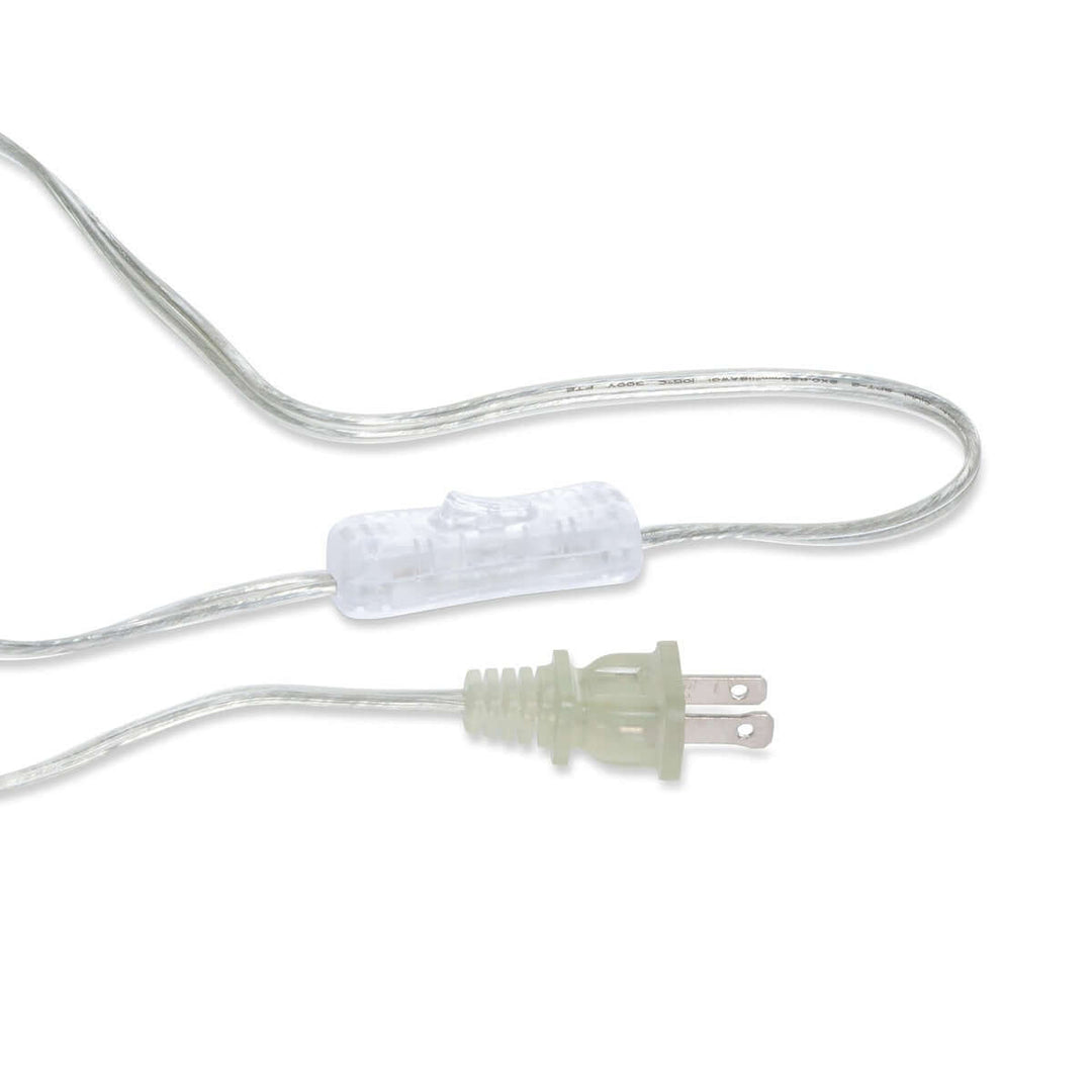 Clear electrical plug with on-off switch and silver wire for wall sconce.