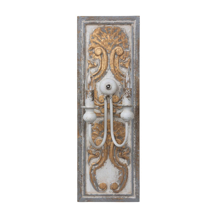 Antique French country wall sconce with carved wooden backplate and distressed gold finish, evoking rustic elegance and historical charm.