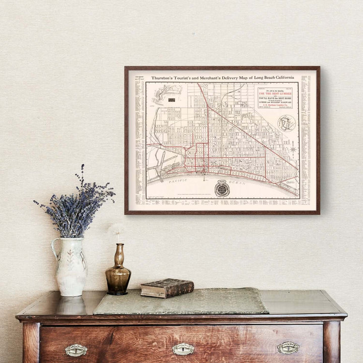 Antique Map of Long Beach, California from 1913 displayed above a vintage dresser with decor