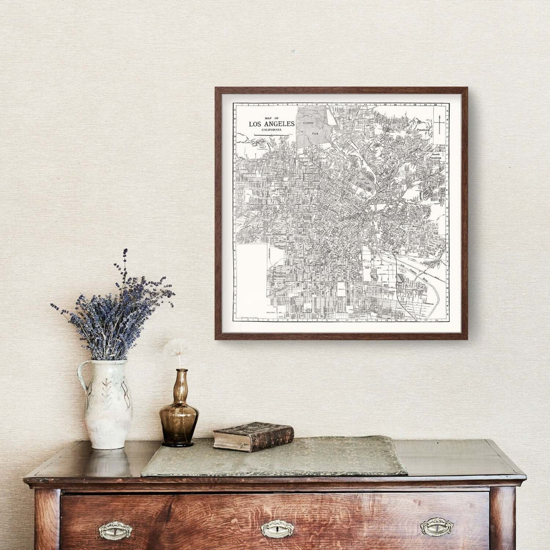 Antique Map of Los Angeles, California from 1929 framed on a wall above a vintage dresser with decorative items.
